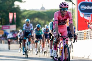 Team Visma-Lease a Bike's British rider Simon Yates wearing the pink jersey of overall leader (Maglia Rosa) celebrates as he crosses the finish line of the 21st and last stage to win the 108th Giro d'Italia cycling race of 143kms from Rome to Rome on June 1, 2025. (Photo by Luca Bettini / AFP)