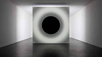 artwork by ryoji ikeda, large screen with circular projections at show by Ryoji Ikeda and Grönlund-Nisunen