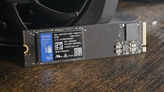 A WD SN5000 SSD out of its box and installed in a PC's NVMe slot.