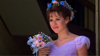 Molly Ringwald as Sam wearing the purple bridemaids dress at the end of Sixteen Candles