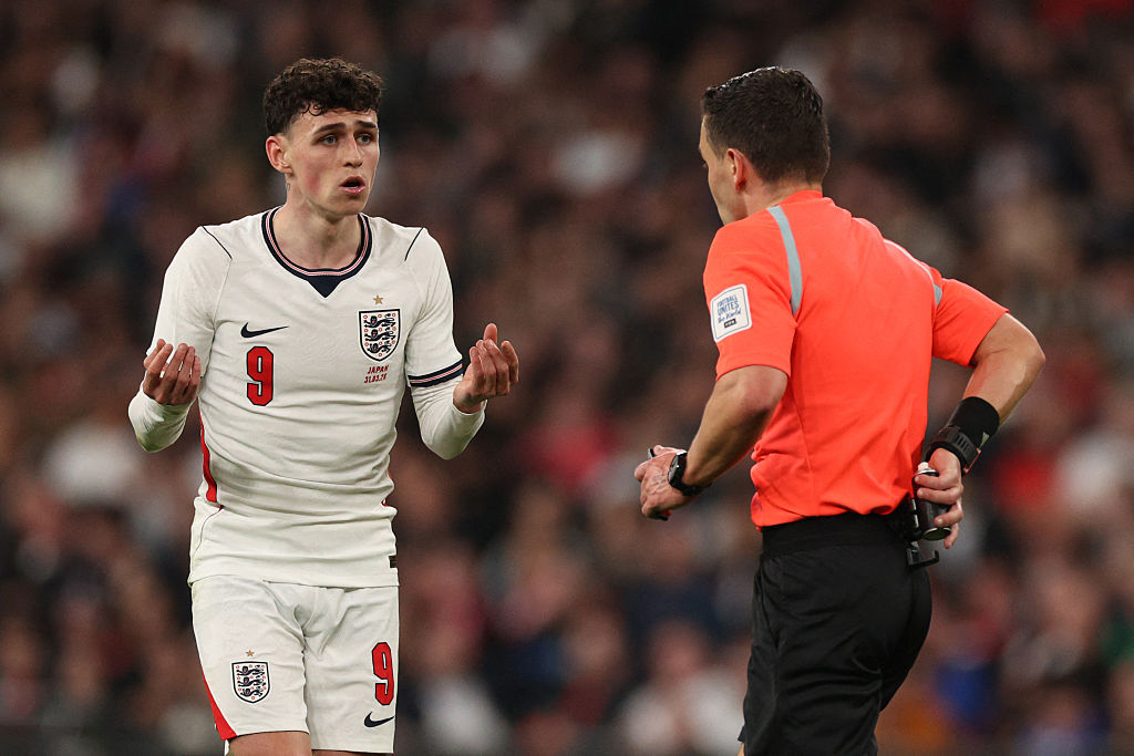 England's midfielder Phil Foden (L) appeals to Scottish referee Nicholas Walsh (R) during the friendly international football match between England and Japan at Wembley Stadium in London on March 31, 2026.