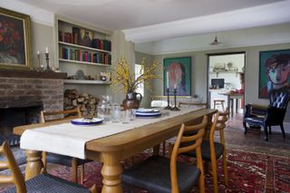 dining_room_with_artwork_tables_chairs_tile_floors