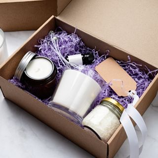 Gift box filled with scented candles and gifts