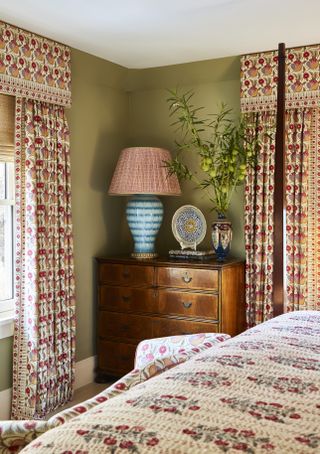 Bedroom with patterned curtains and matching pelmets