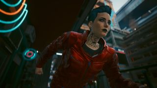 Cyberpunk 2077 screenshot showing a woman with short hair, neck tattoos, and a red jacket running down a city street