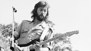 English Blues and Rock musician Eric Clapton plays guitar as he performs onstage, San Francisco, California, August 1975