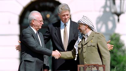 Yitzahk Rabin, Bill Clinton and Yasser Arafat.