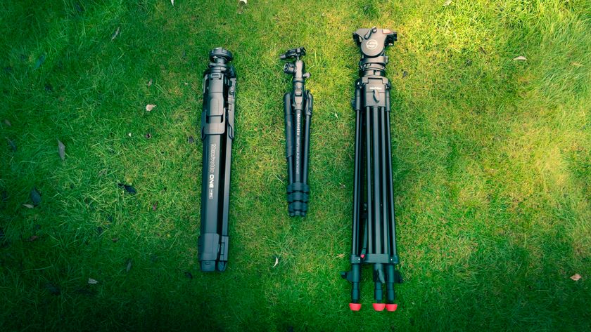 Sachtler and Manfrotto tripods on a grassy background