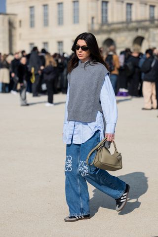 woman wearing sweater vest, button-down shirt, and adidas sambas outfits