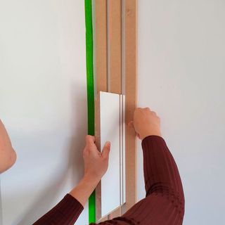 wooden strips on white wall