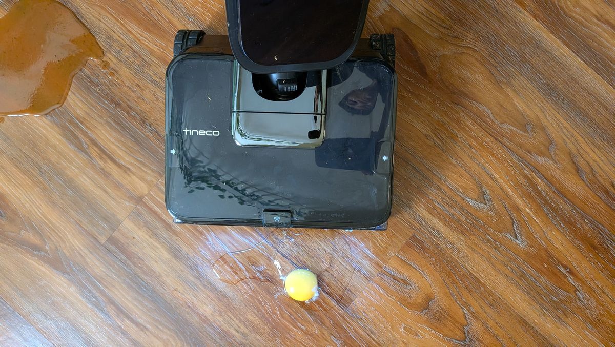 Tineco Floor ONE Station S9 Scientist Pro wet and dry vacuum cleaner about to clean egg off hard wood floor