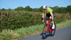 Cyclist sprints in summer kit