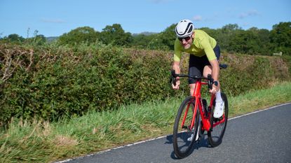 Cyclist sprints in summer kit