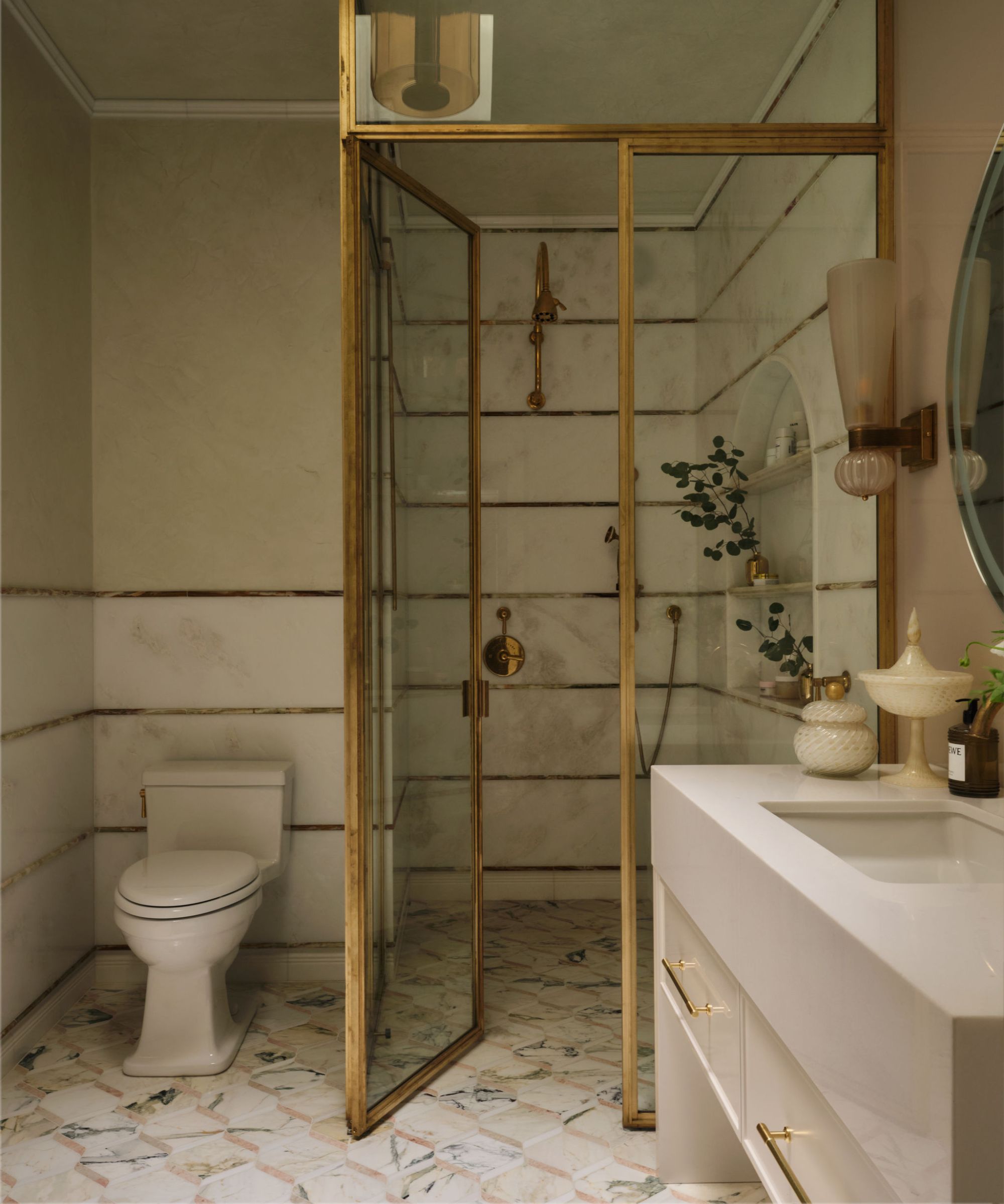 a grand ensuite bathroom with a large brass shower enclosure and a mix of marble and onyx tiles