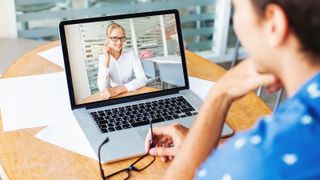 Person with a laptop making a video conference call - hybrid working