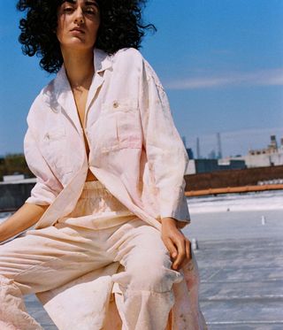 Model wears Mara Hoffman botanical dye shirt and trousers