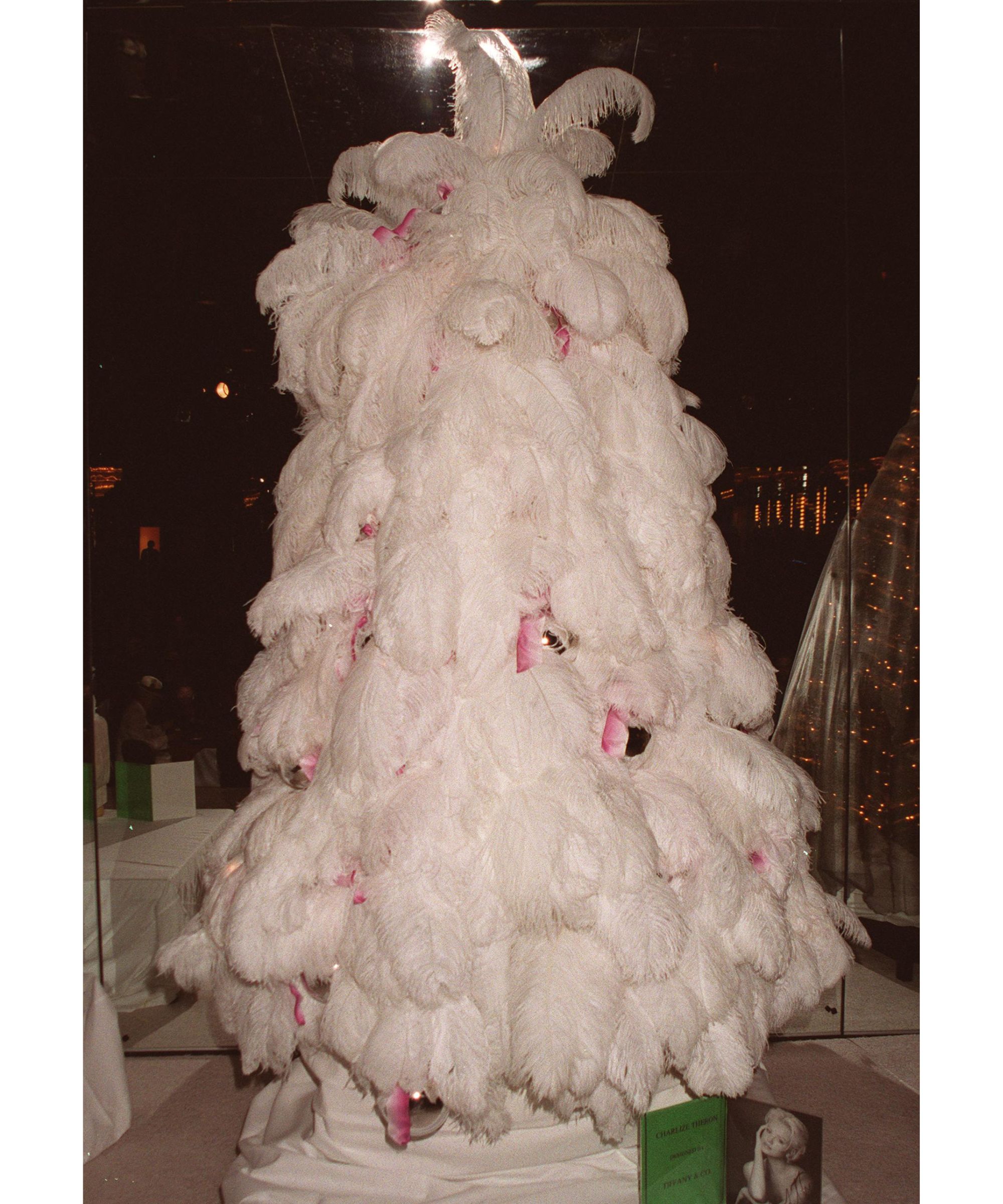 White feather Christmas tree with pink bows and silver baubles belonging to the actor Charlize Theron