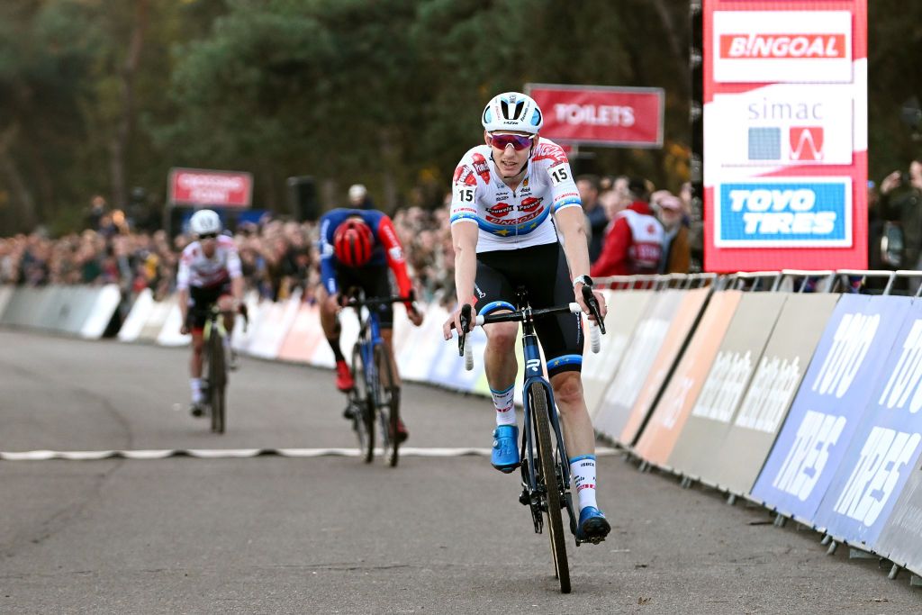 BERGEN NETHERLANDS NOVEMBER 13 Michael Vanthourenhout of Belgium and Team Pauwels Sauzen Bingoal crosses the finish line on third place during the 1st UCI Cyclocross World Cup Beekse Bergen 2022 Mens Elite CXWorldCup BeekseBergen Cyclocross on November 13 2022 in Bergen Netherlands Photo by Luc ClaessenGetty Images