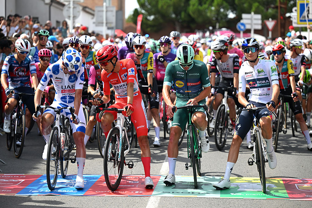 ALFARO, SPAIN - AUGUST 31: (L-R) Jay Vine of Australia and UAE Team Emirates - XRG - Polka dot Mountain Jersey, Torstein Traeen of Norway and Team Bahrain - Victorious - Red Leader Jersey, Mads Pedersen of Denmark and Team Lidl - Trek - Green points jersey and Giulio Pellizzari of Italy and Team Red Bull - BORA - hansgrohe - White best young jersey prior to the La Vuelta - 80th Tour of Spain 2025, Stage 9 a 195.5km stage from Alfaro to Estacion de Esqui de Valdezcaray 1541m / #UCIWT / on August 31, 2025 in Alfaro, Spain. (Photo by Dario Belingheri/Getty Images)