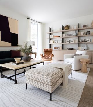 two rugs in a living room, white modern living room by Marie Flanigan Interiors