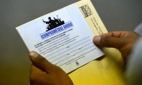 A man stares at an empty application for the Deferred Action for Childhood Arrivals program Aug. 15, the first day President Obama&amp;#039;s policy goes into effect.