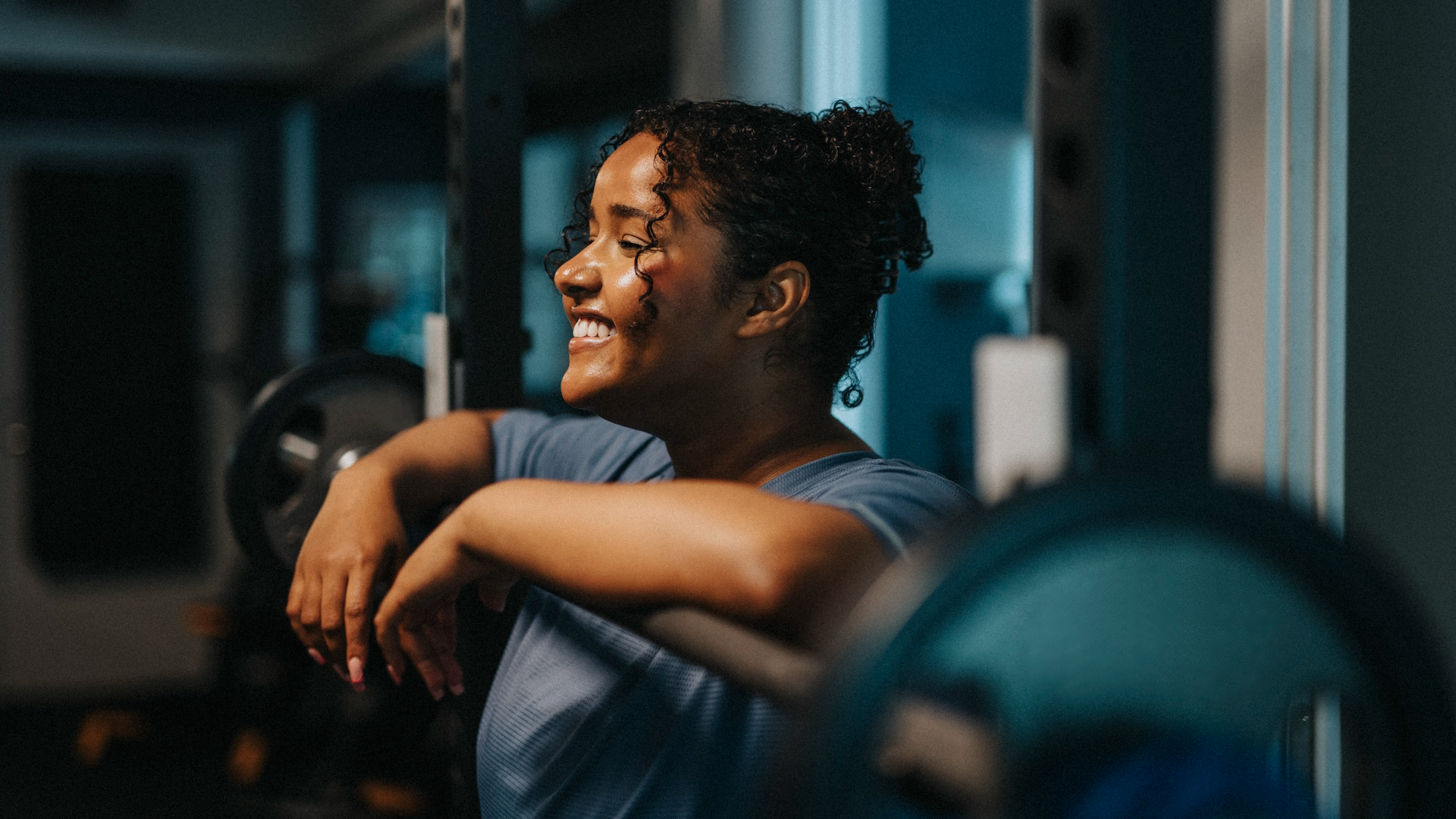 Woman lifting weights at gym