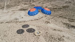 Another image showing the New Shepard crew capsule landing at a remote site in the West Texas desert after a successful mission to space on April 14, 2021.