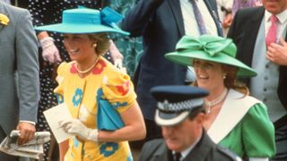 Diana, Princess of Wales, wearing a yellow suit with red, blue and white flowers with a blue hat with a large bow, and Sarah Ferguson, Duchess of York attend Royal Ascot in 1987