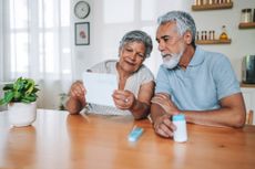 Older couple looking at a prescription bill 