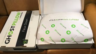 Two GhostBed GhostPillows in their delivery boxes, one open