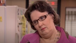 Phyllis frowning in the office