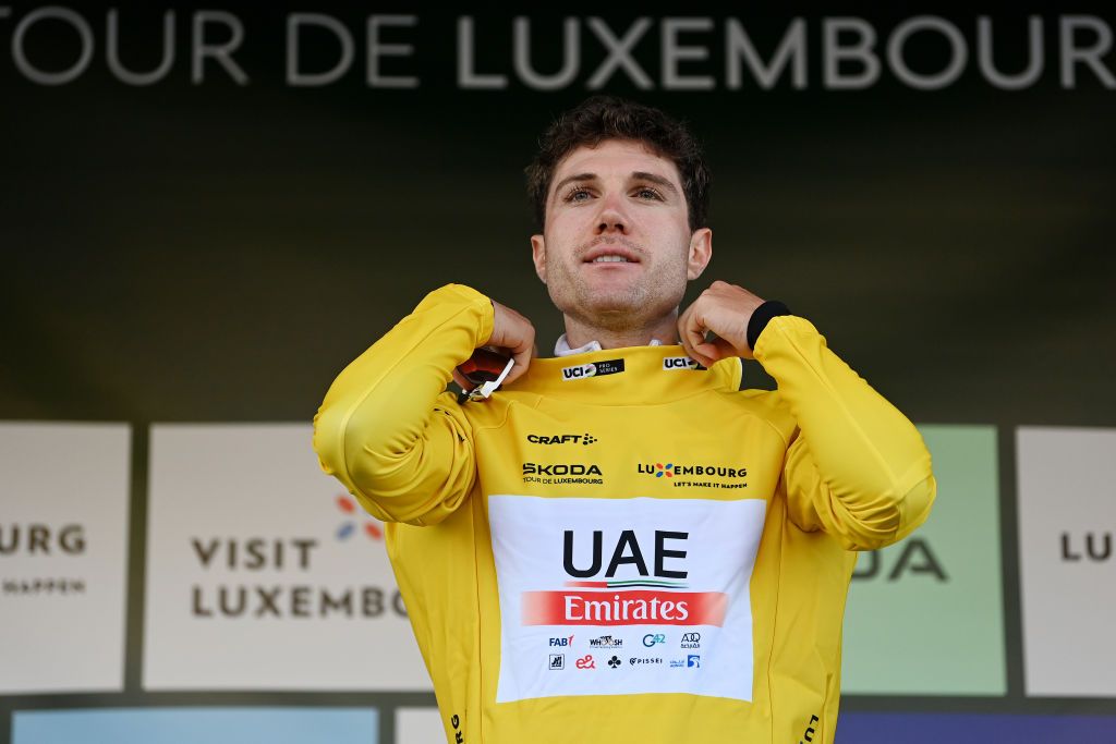 PETANGE LUXEMBOURG SEPTEMBER 23 Marc Hirschi of Switzerland and UAE Team Emirates celebrates at podium as Yellow leader jersey winner during the 83rd Skoda Tour Luxembourg 2023 Stage 4 a 239km individual time trial from Ptange to Ptange on September 23 2023 in Petange Luxembourg Photo by Tim de WaeleGetty Images