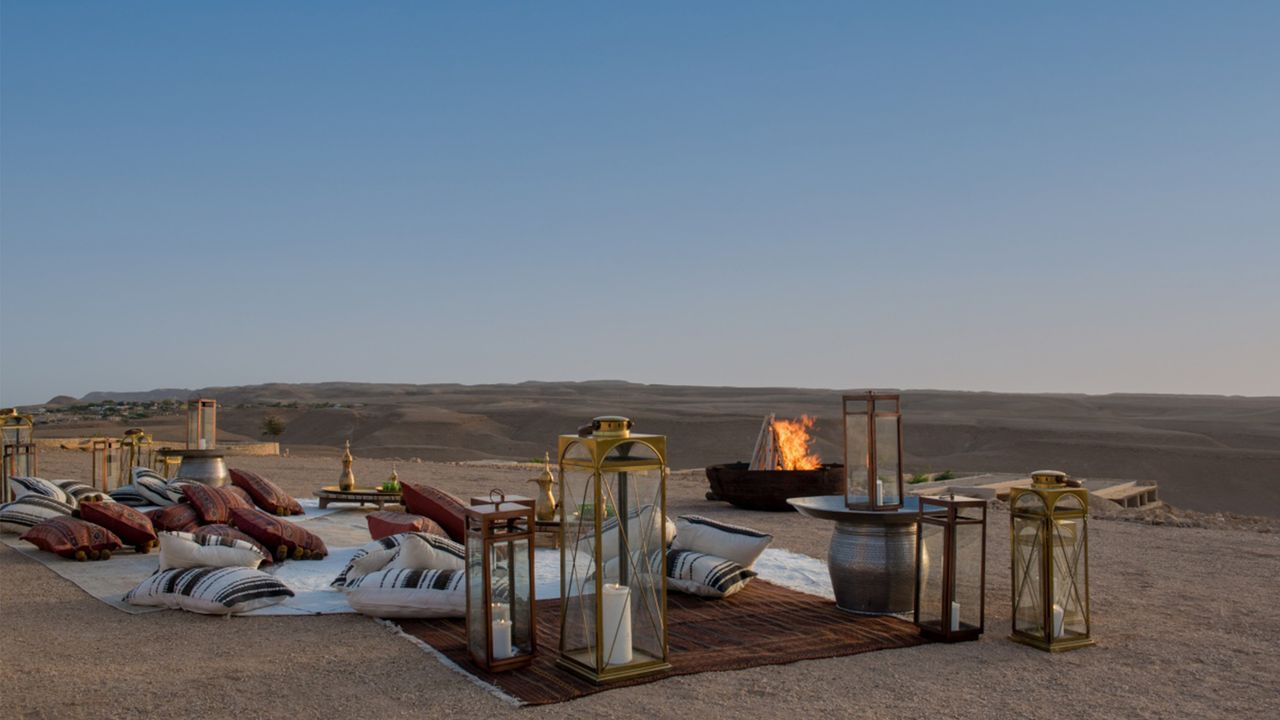 Six Senses Shaharut resort terrace with seating and fire in desert in Israel