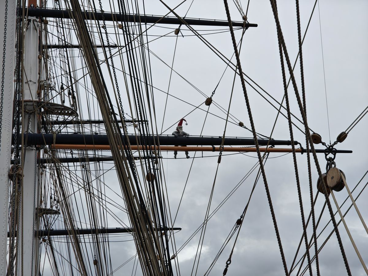 A photo of a man hanging from rigging, taken on the Nothing Phone 3.