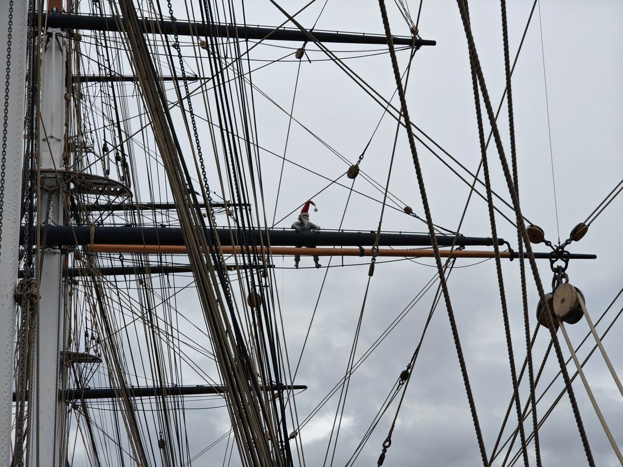 A photo of a man hanging from rigging, taken on the Nothing Phone 3.