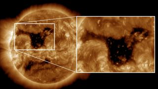 coronal hole on the surface of the sun on Jan. 28. close up view on the right shows a colossal dark region.