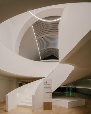 curving staircase inside Musée national de la Marine, Paris, 2023 ©Maxime Verret for h2o architectes and Snøhetta