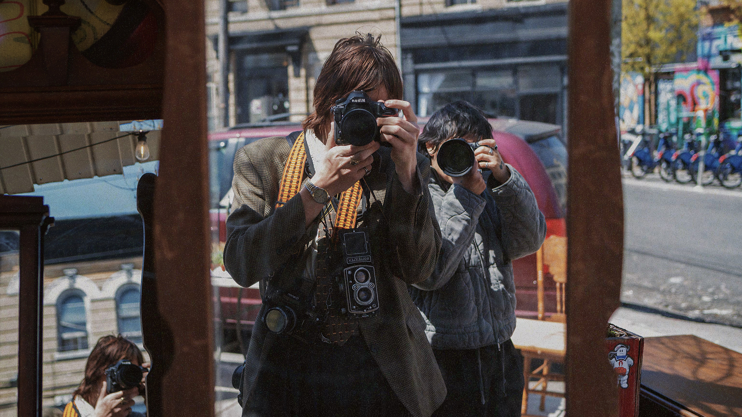 Photographers use a variety of cameras on a VSCO anti-AI campaign