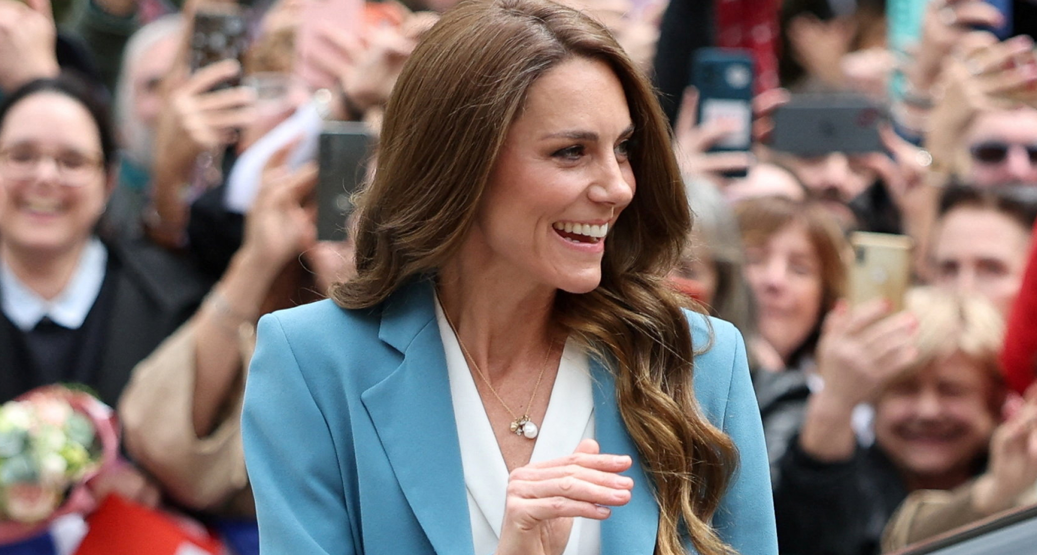 Princess Kate waving in a blue suit