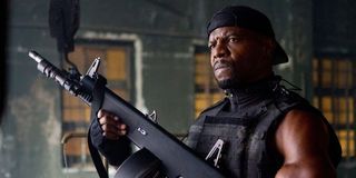 Terry Crews with a machine gun in the Expendables