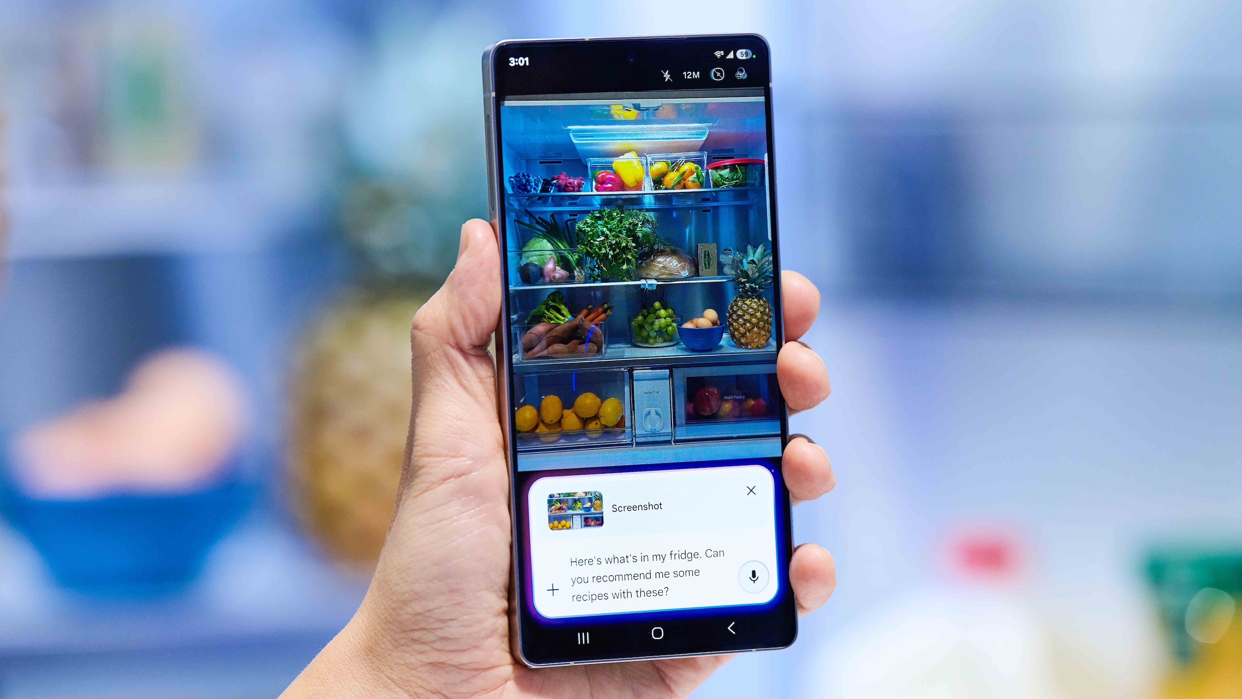The Samsung Galaxy S25 being pointed at a fridge to show its contents on screen.