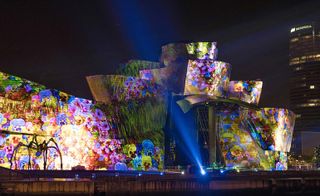 The lightshow is projected onto the vast, reflective North-facing wall of the museum