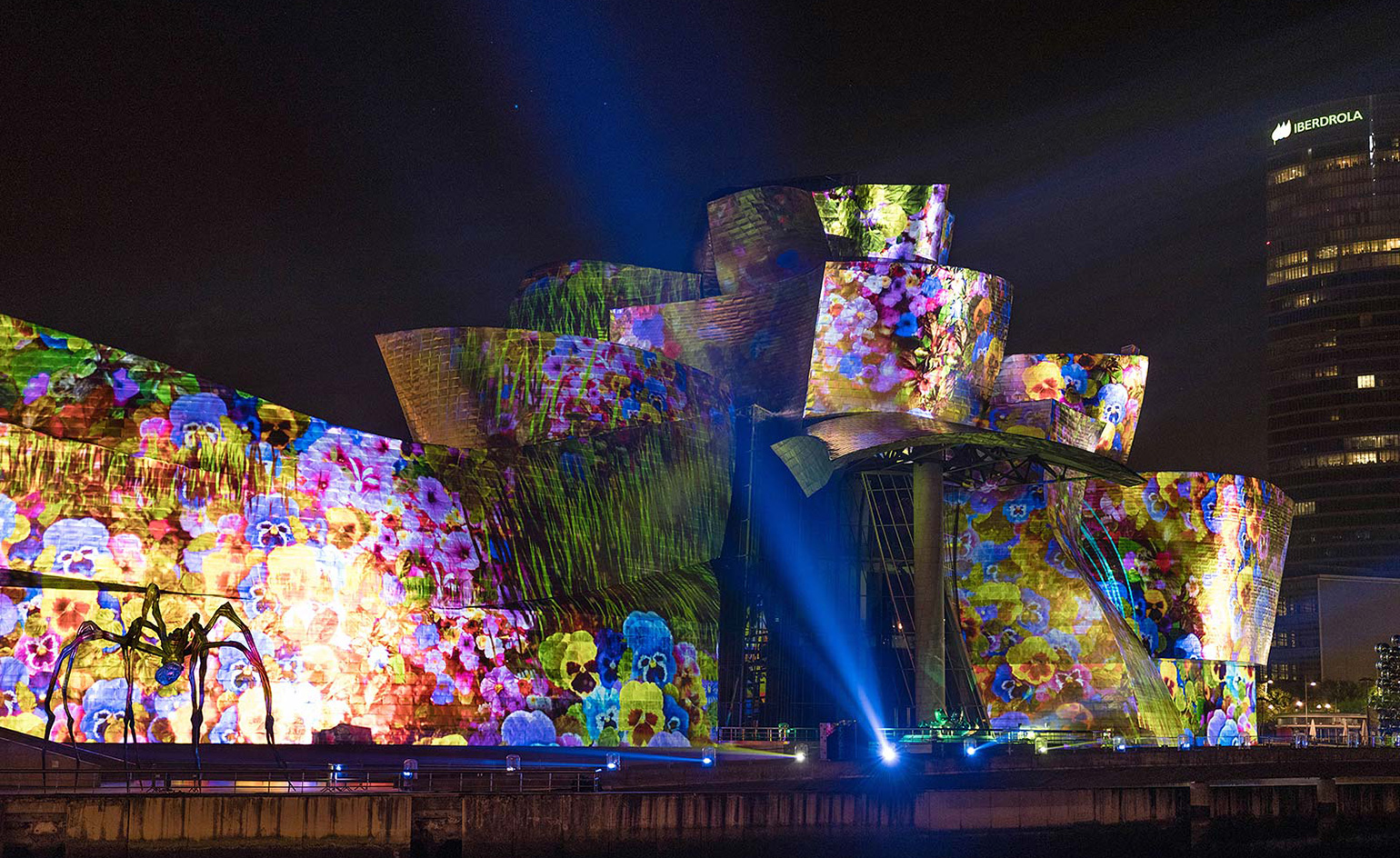 The lightshow is projected onto the vast, reflective North-facing wall of the museum