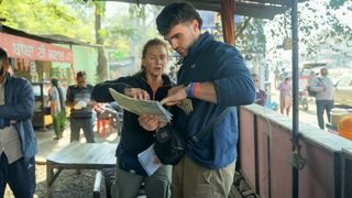 Race Across the World season 5 Caroline and Tom pour over a map in episode 6