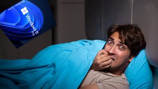 Man in bed having a nightmare about Windows 11