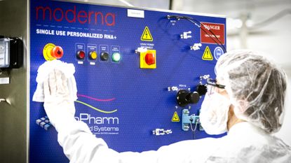 An employee works in a lab focused on cancer vaccine research at the Moderna headquarters in Cambridge, Massachusetts.