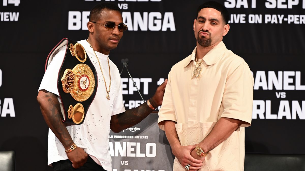 Erislandy Lara (L) and Danny Garcia (R) pose at the weigh-on for their fight with sunglasses on and straps over their shoulders.