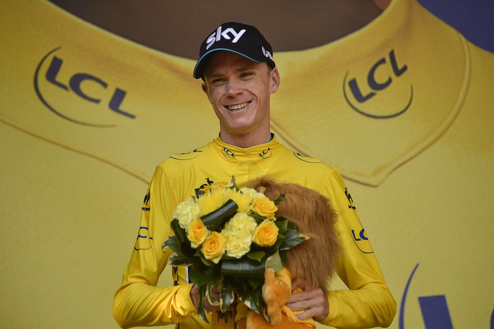 Chris Froome in yellow on the stage 18 podium.