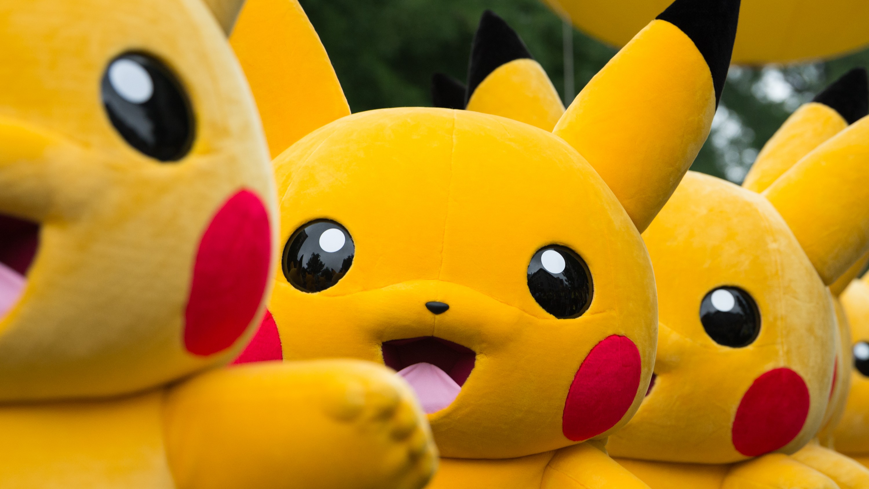 Performers dressed as the Pikachu character from Nintendo Co.'s Pokemon franchise march during the Pikachu Carnival Parade organised by Pokemon Co. in Yokohama, Japan, on Monday, Aug. 14, 2017. 