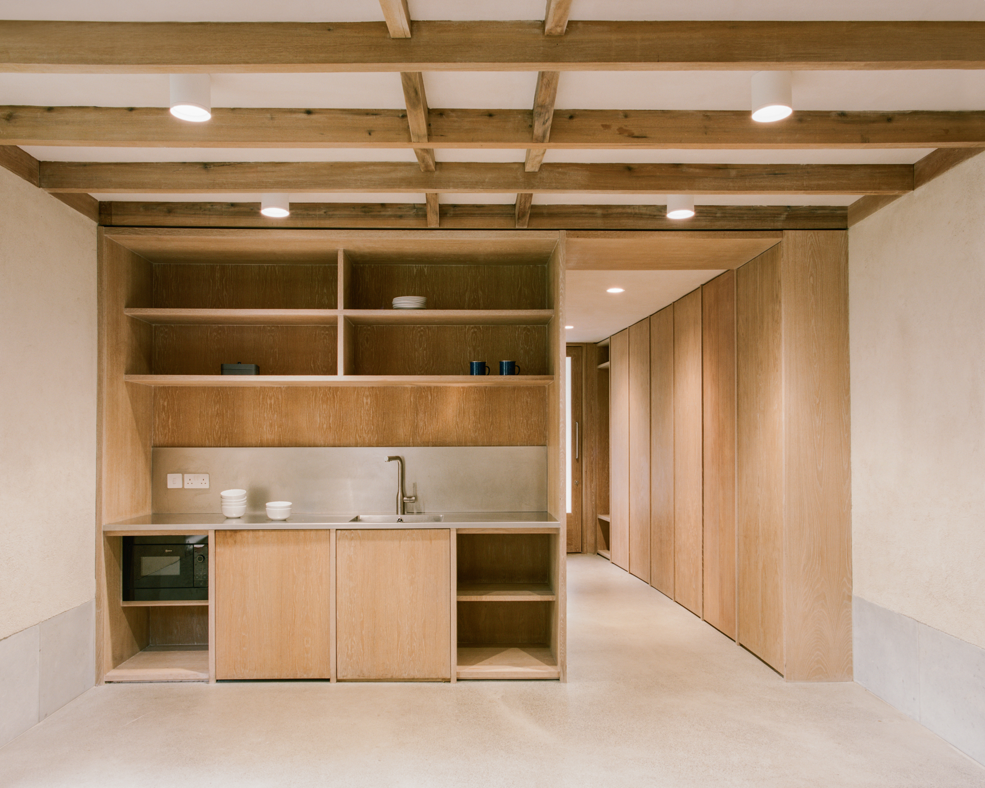 view of Finsbury Circus Parks Office, a minimalist, earthy building set among leafy garden